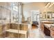 Bathroom showcasing a walk-in shower, soaking tub, double sinks, and tiled floors at 16399 Somerset Dr, Broomfield, CO 80023