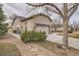 Exterior view of home featuring a well-kept lawn and two-car garage at 16399 Somerset Dr, Broomfield, CO 80023