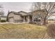 Charming home exterior with a stone facade and a well-maintained lawn at 16399 Somerset Dr, Broomfield, CO 80023