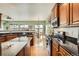 Spacious kitchen with granite countertops, stainless steel appliances, and hardwood floors at 16399 Somerset Dr, Broomfield, CO 80023