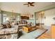 Comfortable living room with open layout, hardwood floors, and an area rug at 16399 Somerset Dr, Broomfield, CO 80023