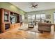 Spacious living room with hardwood floors, a ceiling fan, and lots of natural light at 16399 Somerset Dr, Broomfield, CO 80023