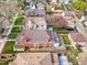 Aerial view of a neighborhood with mature trees, well-maintained homes, and a spacious backyard with a wooden deck at 2772 Julian St, Denver, CO 80211