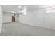 Finished basement features neutral carpet, recessed lighting, and stairs to the upper level, perfect for a rec room at 2772 Julian St, Denver, CO 80211