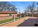 Large wood deck with black railings provides ample outdoor living and entertaining space at 2772 Julian St, Denver, CO 80211