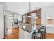 A spacious kitchen features a large island with bar seating, granite countertops, and stainless steel appliances at 2772 Julian St, Denver, CO 80211