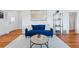 Well-lit living room featuring hardwood floors, modern decor, and a cozy atmosphere for relaxation and entertainment at 2772 Julian St, Denver, CO 80211