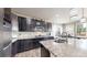 Well-appointed kitchen with stainless steel appliances, granite countertops, and a mosaic backsplash at 3885 Sandoval St, Brighton, CO 80601