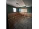 Basement area with paneling, tile flooring, and natural light from two windows at 21041 E Ida Ave, Centennial, CO 80015