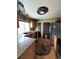 Kitchen featuring granite countertops, wooden cabinets, and a stainless steel refrigerator at 21041 E Ida Ave, Centennial, CO 80015