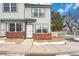 Charming townhome featuring a well-maintained exterior and neatly landscaped front yard at 6052 Jay St, Arvada, CO 80003