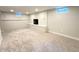Spacious basement area featuring carpeted flooring and fireplace at 3578 Ivanhoe St, Denver, CO 80207