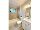Updated bathroom featuring a shower-tub combo, stylish vanity, and natural light at 3578 Ivanhoe St, Denver, CO 80207