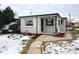 Charming single-story home with a brick exterior, landscaped yard, and welcoming entrance at 3578 Ivanhoe St, Denver, CO 80207