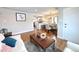 Bright, open-concept living room with hardwood floors connecting seamlessly to the modern kitchen at 3578 Ivanhoe St, Denver, CO 80207