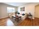 Comfortable living room with large windows, plush sofas, hardwood floors, and modern accents at 3578 Ivanhoe St, Denver, CO 80207