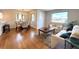 Inviting living room and dining area with hardwood floors, lots of natural light, and contemporary decor at 3578 Ivanhoe St, Denver, CO 80207