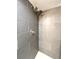 Shower featuring gray tile and shower head at 3578 Ivanhoe St, Denver, CO 80207