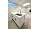 Wet bar in basement with white shaker cabinets, white countertops, and stainless faucet at 3578 Ivanhoe St, Denver, CO 80207