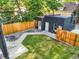 Backyard with a small outbuilding, fencing, and a well-maintained lawn at 734 N Downing St, Denver, CO 80218