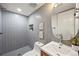 Modern bathroom with unique tiling, sleek fixtures, and space-saving inset shelf at 734 N Downing St, Denver, CO 80218