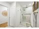 Modern bathroom with a glass-enclosed shower, decorative lighting, and neutral color palette, emphasizing cleanliness and style at 734 N Downing St, Denver, CO 80218