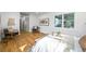 Spacious bedroom showing hardwood floors and modern decor, capturing a cozy chair, and natural lighting at 734 N Downing St, Denver, CO 80218