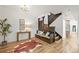 Stylish entryway featuring a wooden staircase, bench seating, and hardwood floors at 734 N Downing St, Denver, CO 80218