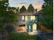 Back of house showing a backyard and covered patio with outdoor dining area at 734 N Downing St, Denver, CO 80218