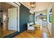 Welcoming front porch with seating and an open door, showcasing the home's entrance at 734 N Downing St, Denver, CO 80218