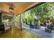 Inviting covered porch with wooden floors, white railings and columns, and outdoor seating at 734 N Downing St, Denver, CO 80218