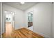 Hallway view of bedroom and bathroom showcasing the home's open floor plan and natural light at 734 N Downing St, Denver, CO 80218
