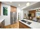Bright and airy kitchen with stainless steel appliances, wood cabinets and breakfast bar at 734 N Downing St, Denver, CO 80218