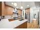 Gorgeous kitchen with stainless steel appliances, center island, and quartz countertops at 734 N Downing St, Denver, CO 80218