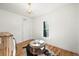 Well-lit laundry room with chandelier, ottoman, and natural light from a window at 734 N Downing St, Denver, CO 80218