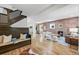 Bright, open living space featuring a brick fireplace, hardwood floors, and a cozy seating area at 734 N Downing St, Denver, CO 80218