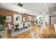 Beautiful brick wall in the living room with hardwood floors and stylish furniture at 734 N Downing St, Denver, CO 80218