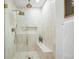 Detail shot of a luxurious shower featuring dual showerheads, a built-in niche, and elegant tiling at 734 N Downing St, Denver, CO 80218