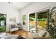 Inviting sitting room with glass doors to the backyard and comfortable seating at 734 N Downing St, Denver, CO 80218