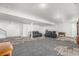 Finished basement with a comfortable seating area and plenty of natural light at 1222 S County Road 185, Byers, CO 80103