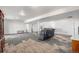 Finished basement with comfortable seating area and plenty of room to entertain at 1222 S County Road 185, Byers, CO 80103