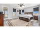 Light-filled primary bedroom with wood floors and access to the balcony at 1222 S County Road 185, Byers, CO 80103