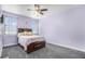 Cozy bedroom with a ceiling fan and a neutral carpet at 1222 S County Road 185, Byers, CO 80103