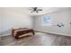 Bedroom with a hardwood floor, ceiling fan and a window at 1222 S County Road 185, Byers, CO 80103