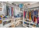 Walk-in closet with custom shelving for shoes and clothing at 1222 S County Road 185, Byers, CO 80103