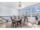 Elegant dining room showcasing a dark wood table, seating for six, and ample natural light at 1222 S County Road 185, Byers, CO 80103