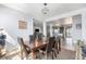 Dining area with views to the living spaces, featuring modern lighting and seating for six at 1222 S County Road 185, Byers, CO 80103