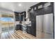 Beautiful kitchen with dark cabinets and stainless steel appliances at 1222 S County Road 185, Byers, CO 80103