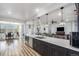Large kitchen island featuring modern pendant lights and sink at 1222 S County Road 185, Byers, CO 80103