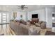 Inviting living room featuring a fireplace, wood flooring, and comfortable seating arrangement at 1222 S County Road 185, Byers, CO 80103